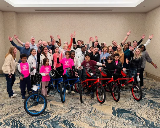 Team building group assembling bicycles for donation